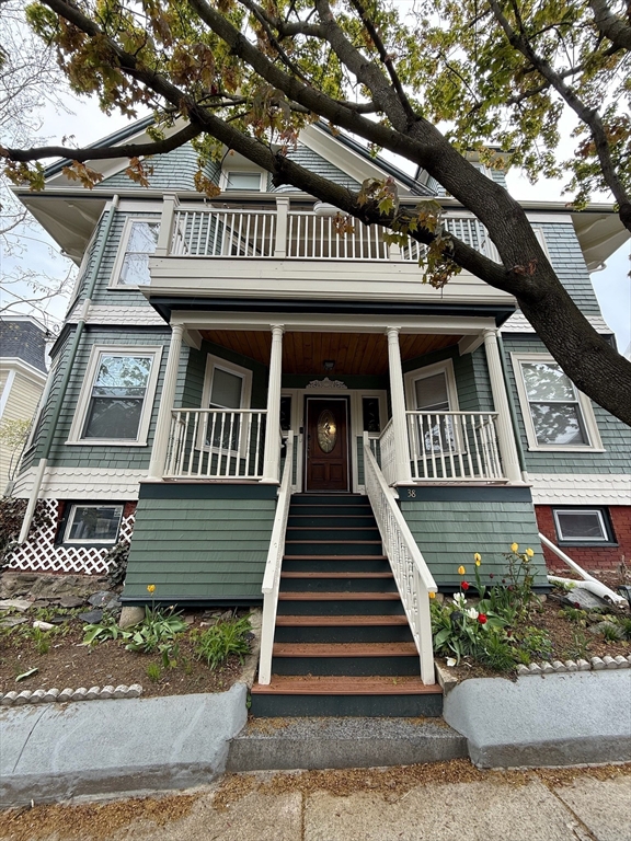 38 Pinckney Street, Unit 3 Somerville, MA 02145 - Photo 39 of 40 front view of a house with a small yard
