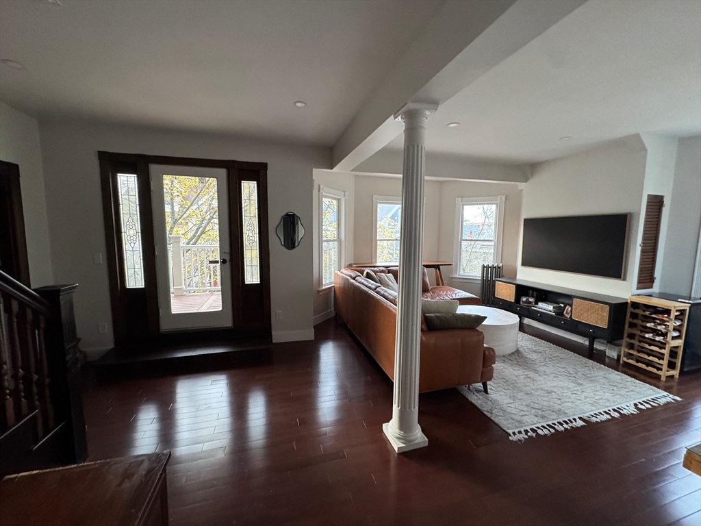 38 Pinckney Street, Unit 3 Somerville, MA 02145 - Photo 6 of 40 a living room with furniture and a flat screen tv