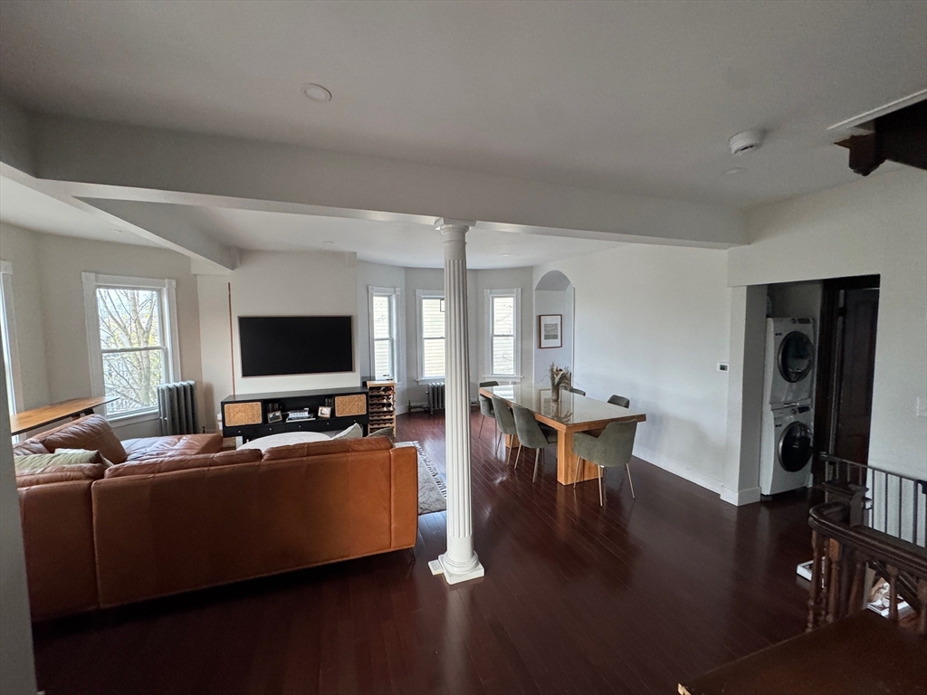 38 Pinckney Street, Unit 3 Somerville, MA 02145 - Photo 8 of 40 a living room with furniture and a flat screen tv