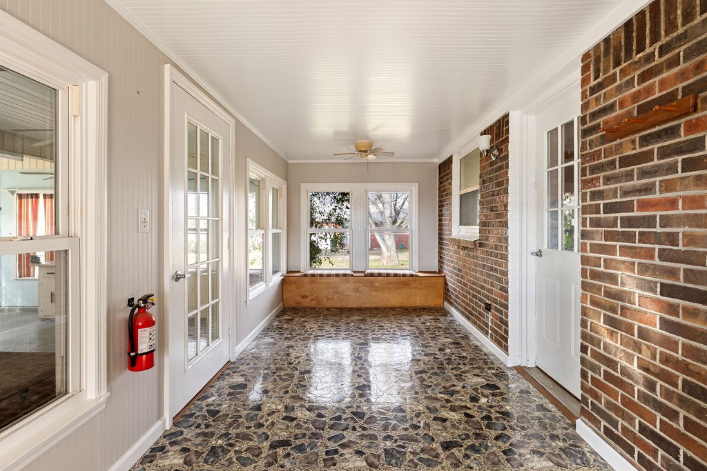 210 Salem Road Minor Hill, TN 38473 - Photo 27 of 27 a view of a hallway with windows and chandelier in a room