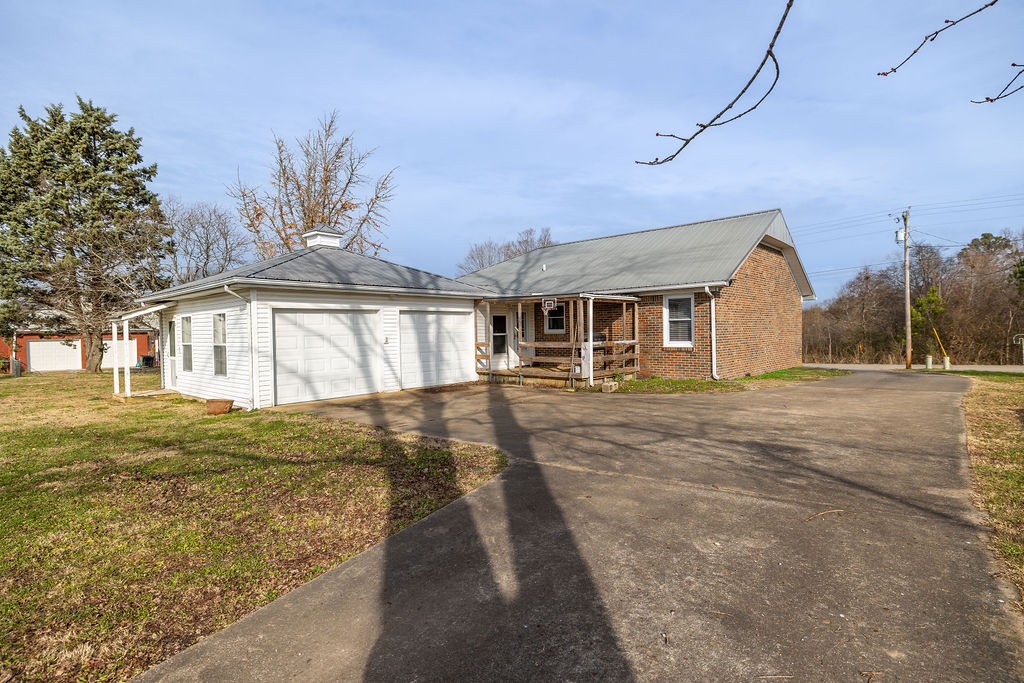 210 Salem Road Minor Hill, TN 38473 - Photo 6 of 27 a front view of a house with a yard