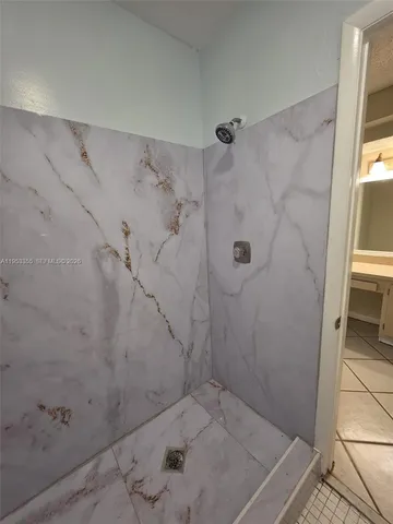 a view of a livingroom with windows