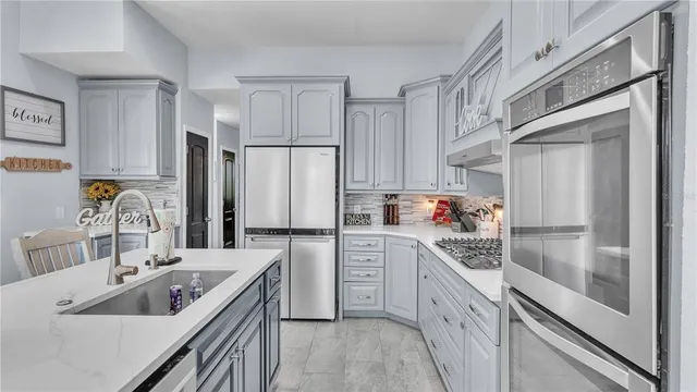 a living room with a fireplace and a floor to ceiling window