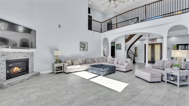 a living room with furniture and a fireplace