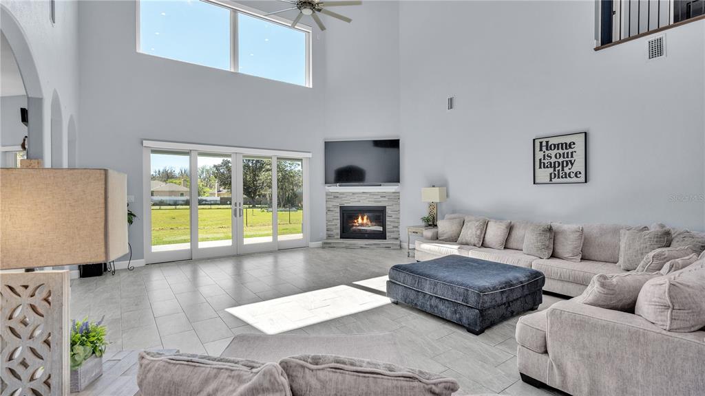 3943 West Campbell Road Lakeland, FL 33810 - Photo 24 of 71 a living room with furniture and a fireplace