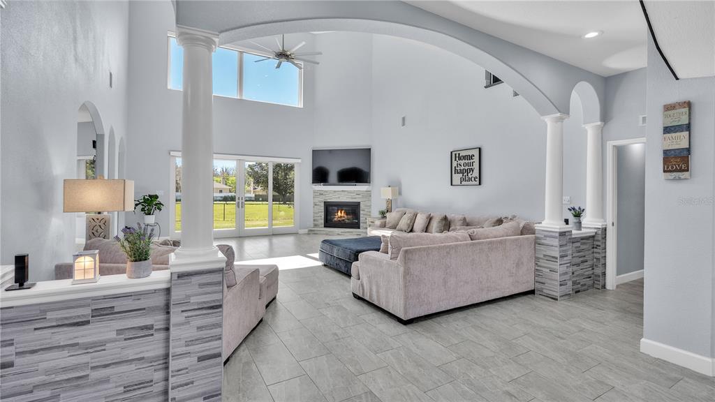 3943 West Campbell Road Lakeland, FL 33810 - Photo 26 of 71 a living room with furniture and a fireplace