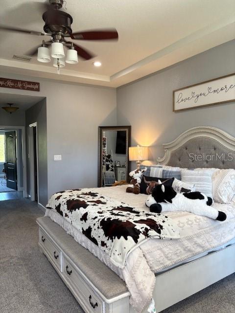 3943 West Campbell Road Lakeland, FL 33810 - Photo 30 of 71 a bedroom with a bed and ceiling fan