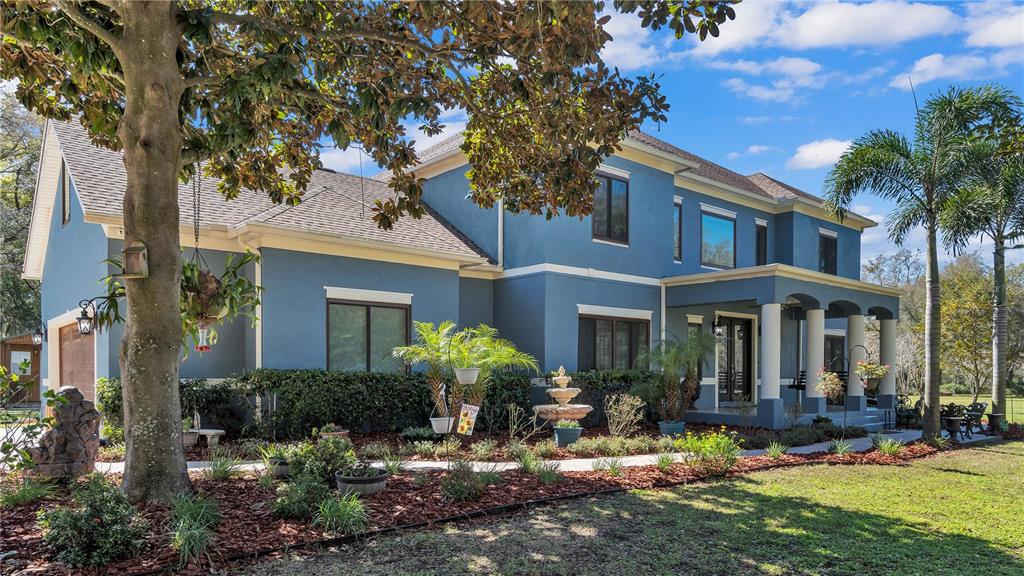 3943 West Campbell Road Lakeland, FL 33810 - Photo 3 of 71 a front view of a house with yard porch and furniture
