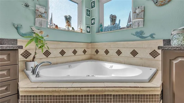 a bedroom with furniture and a flat screen tv