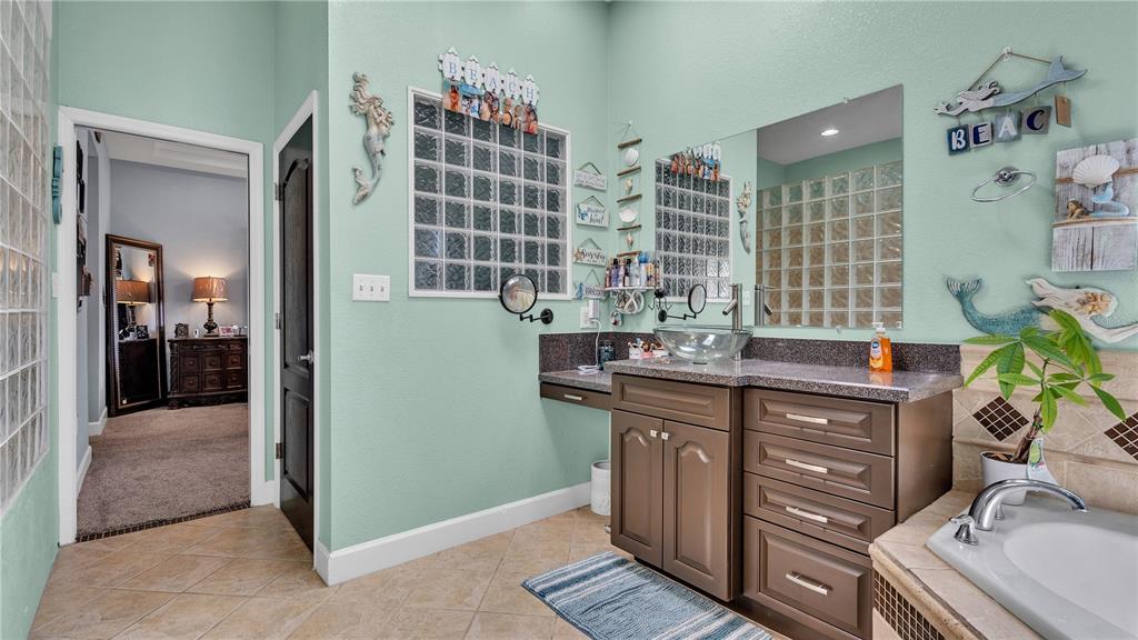 3943 West Campbell Road Lakeland, FL 33810 - Photo 37 of 71 a kitchen with a sink and a refrigerator