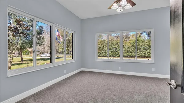 a view of walk in closet with clothes