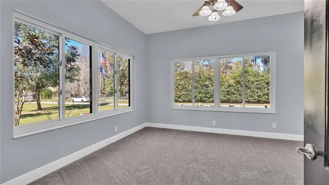 a view of walk in closet with clothes