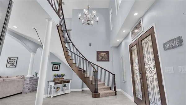 a view of walk in closet with clothes
