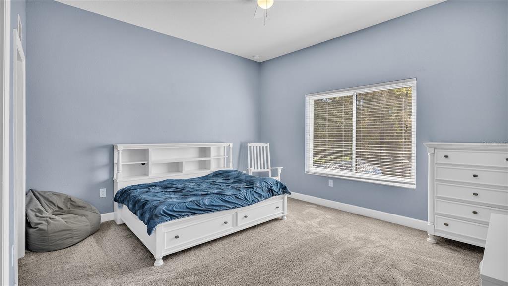 3943 West Campbell Road Lakeland, FL 33810 - Photo 47 of 71 a bedroom with a bed and a dresser