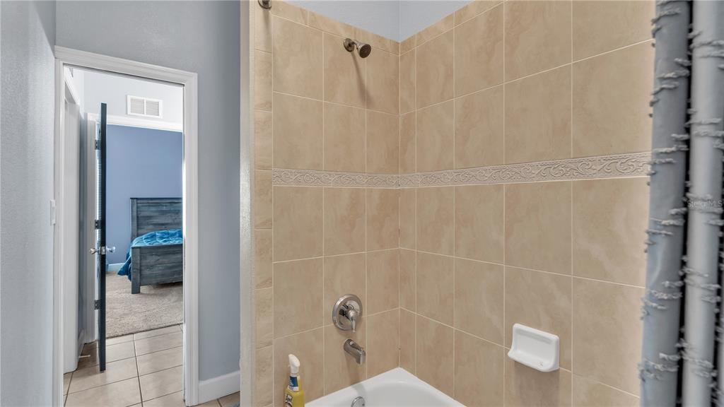 3943 West Campbell Road Lakeland, FL 33810 - Photo 57 of 71 a bathroom with a shower