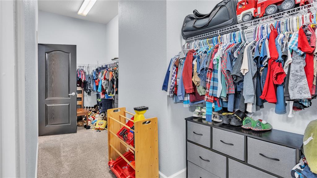 3943 West Campbell Road Lakeland, FL 33810 - Photo 59 of 71 a view of walk in closet with clothes