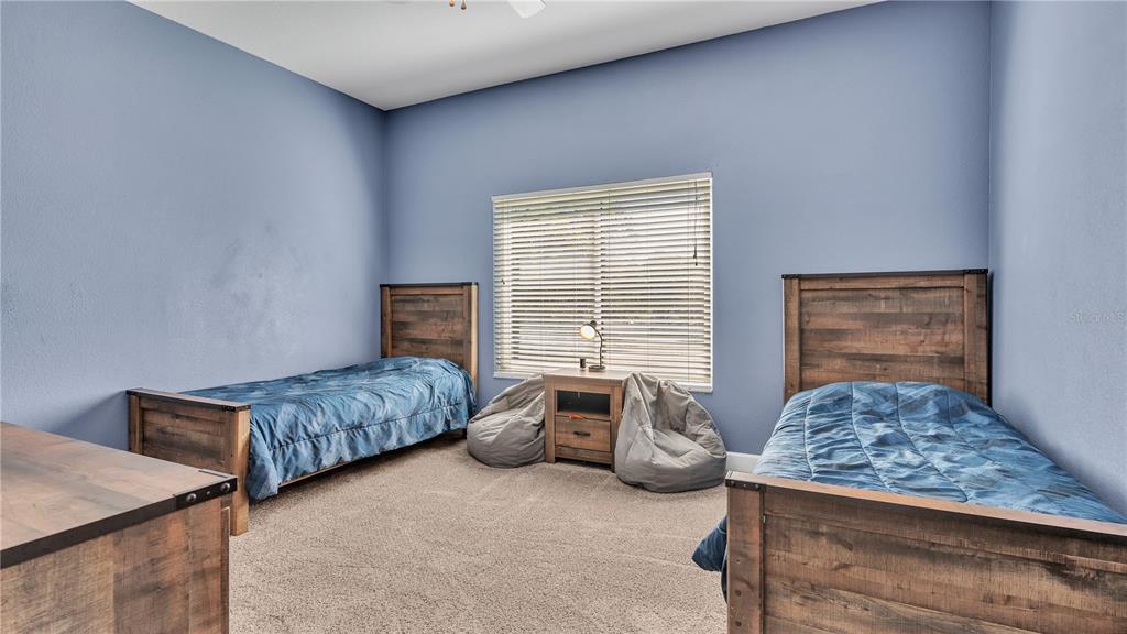 3943 West Campbell Road Lakeland, FL 33810 - Photo 60 of 71 a bedroom with a bed and a window