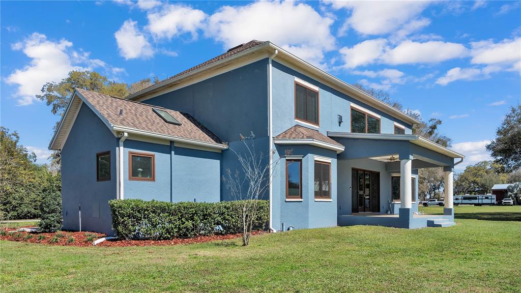 3943 West Campbell Road Lakeland, FL 33810 - Photo 69 of 71 a front view of a house with a yard