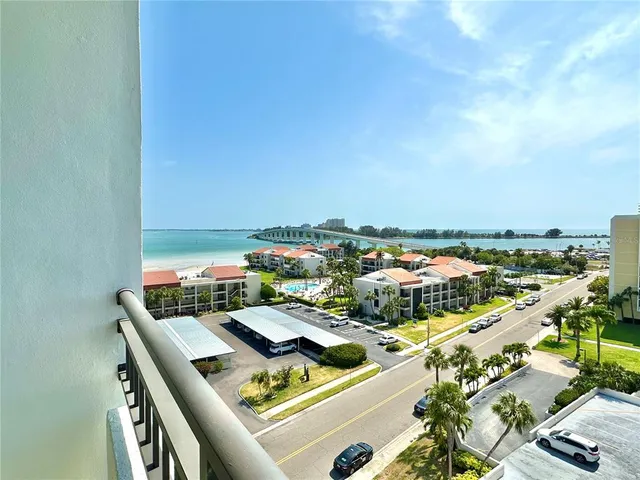 a view of balcony with wooden floor