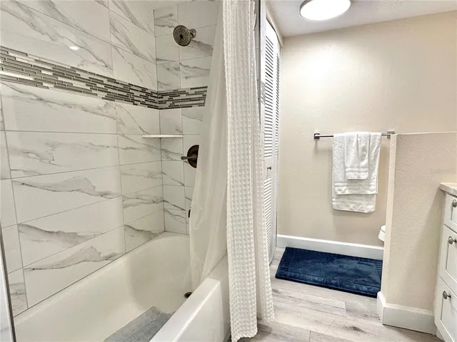 a bathroom with a sink and a shower