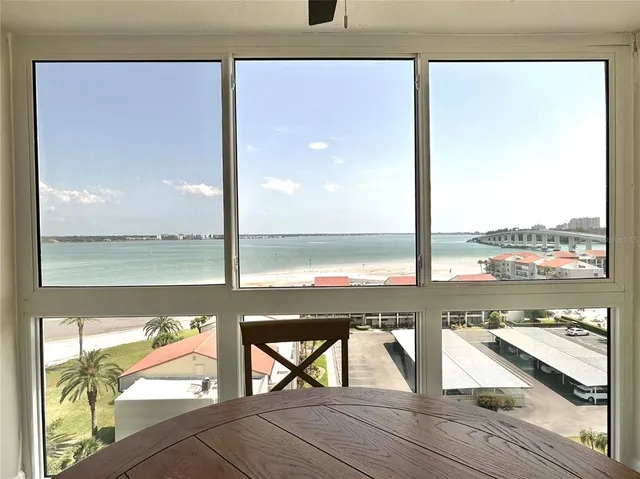 a view of a balcony with wooden floor