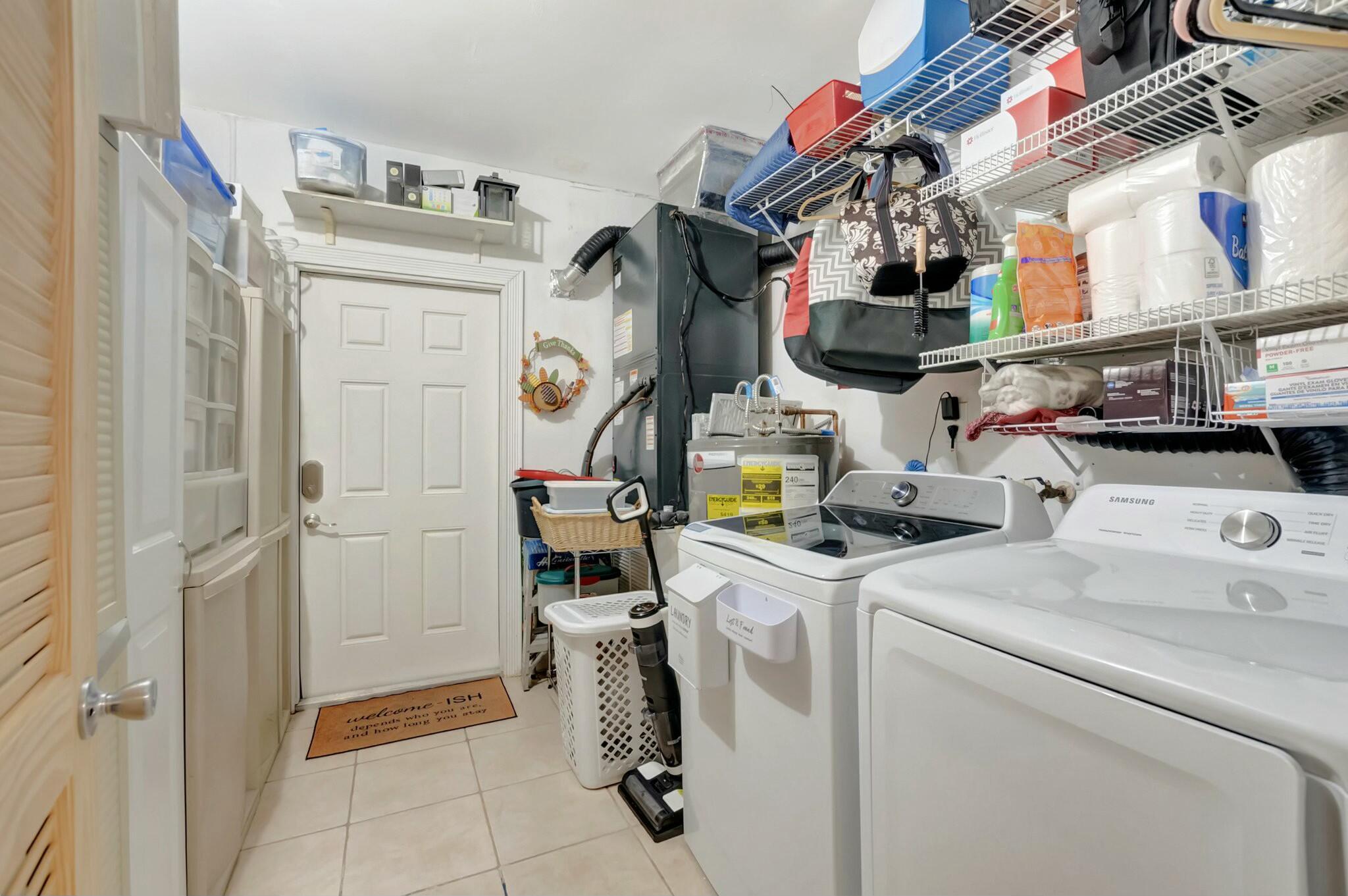 9033 Southwest 6th Street Boca Raton, FL 33433 - Photo 49 of 56 a utility room with dryer and washer
