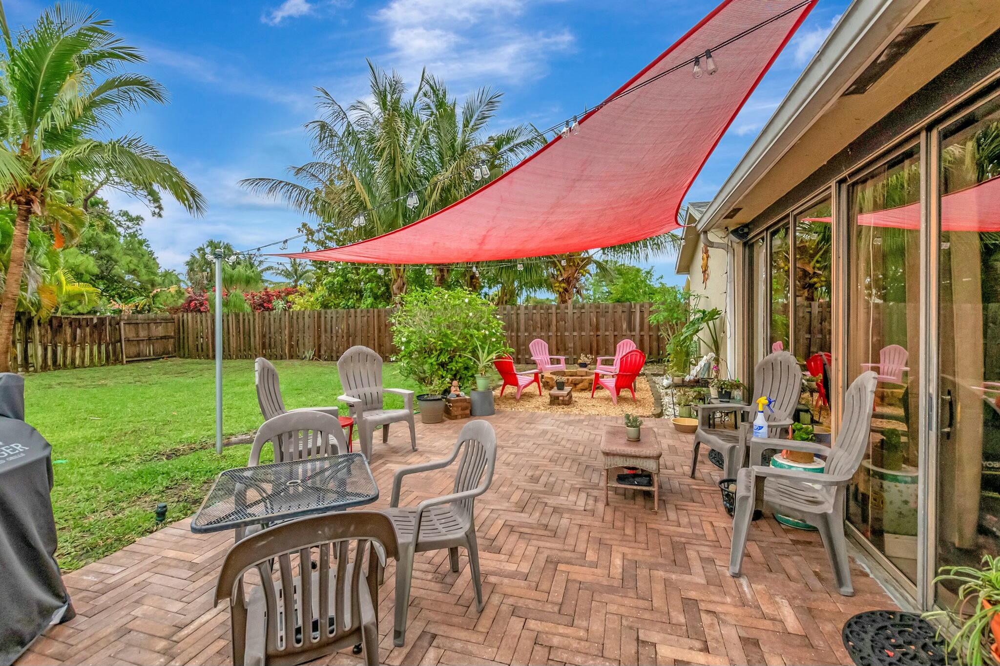 9033 Southwest 6th Street Boca Raton, FL 33433 - Photo 10 of 56 a view of a chairs and table in backyard of the house
