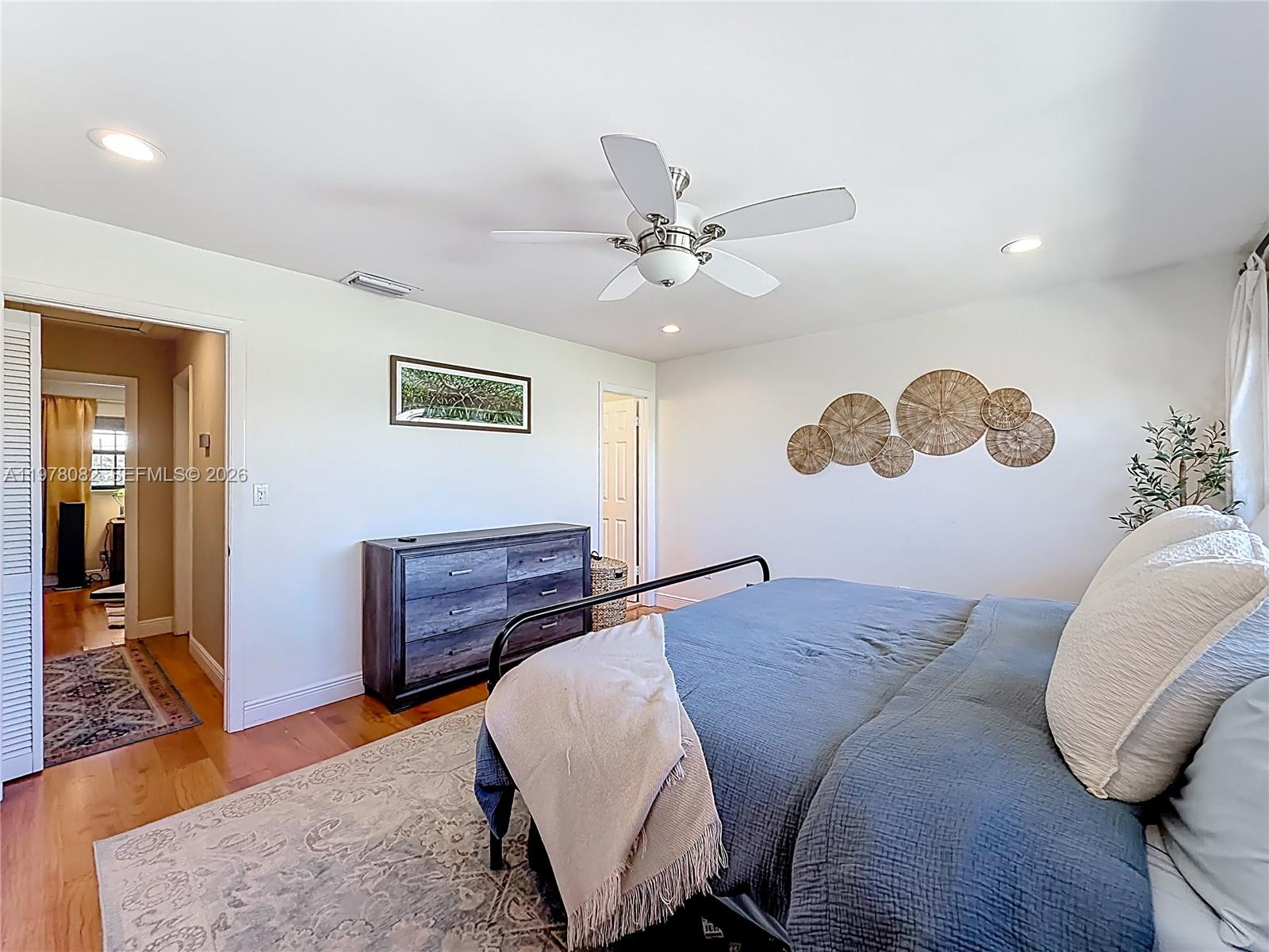 2128 Northeast 9th Avenue Wilton Manors, FL 33305 - Photo 21 of 34 a bed room with a bed and a couch