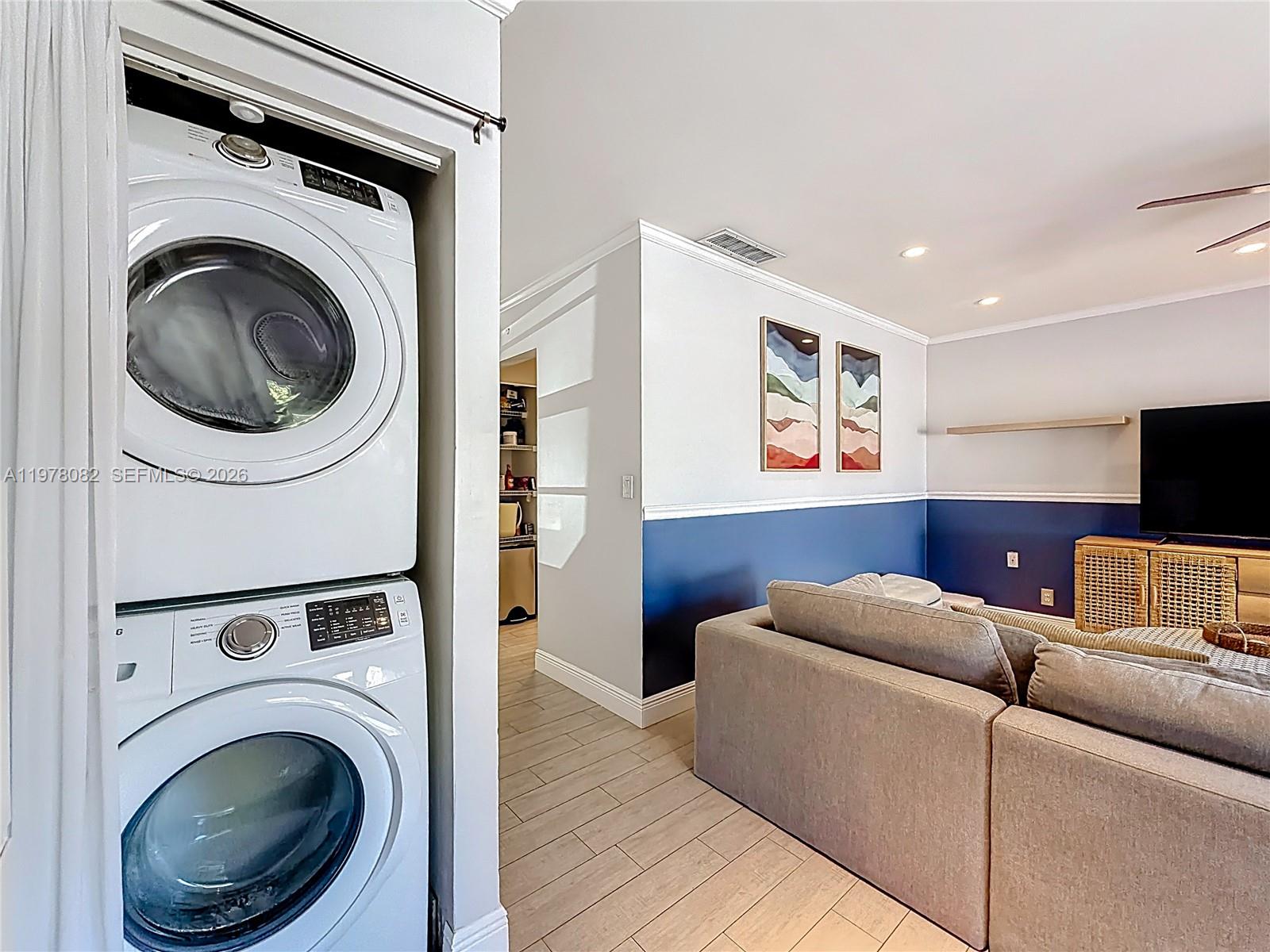 2128 Northeast 9th Avenue Wilton Manors, FL 33305 - Photo 26 of 34 a living room with furniture and a flat screen tv