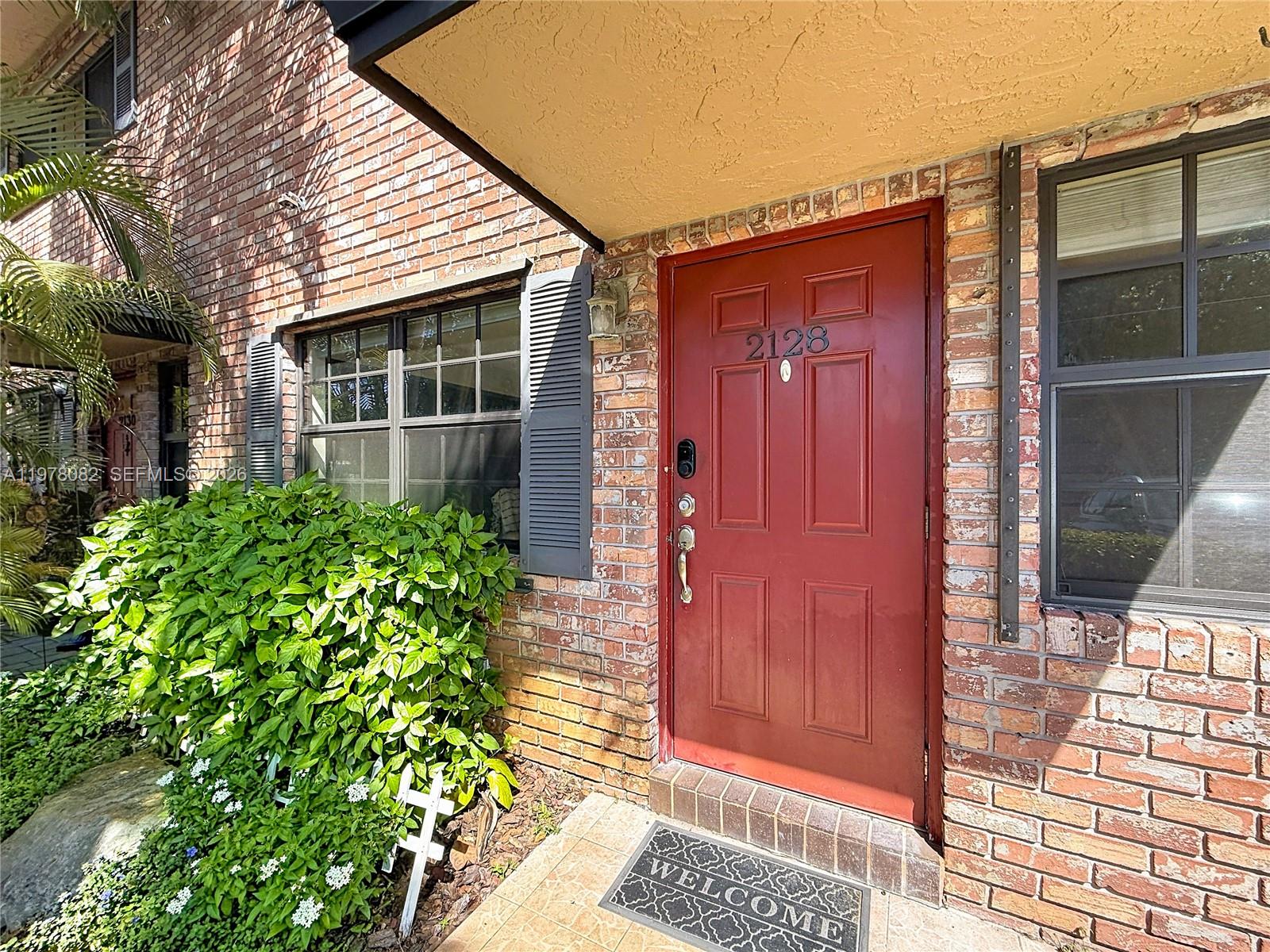2128 Northeast 9th Avenue Wilton Manors, FL 33305 - Photo 3 of 34 a view of front door of house