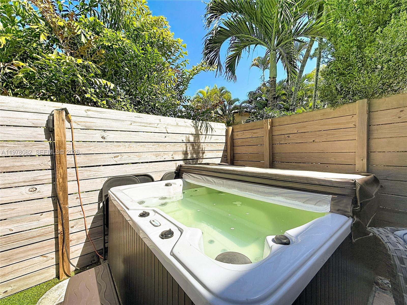 2128 Northeast 9th Avenue Wilton Manors, FL 33305 - Photo 31 of 34 a view of a pool with chairs