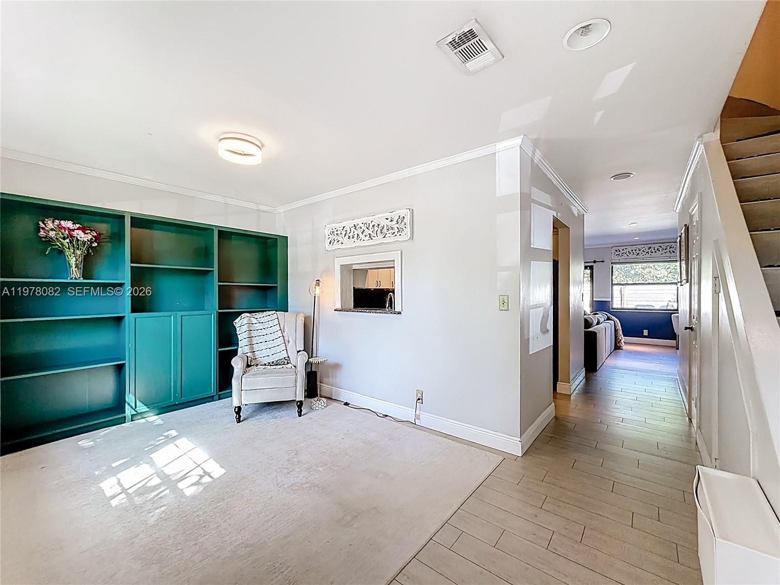 2128 Northeast 9th Avenue Wilton Manors, FL 33305 - Photo 4 of 34 a living room with furniture and a large window
