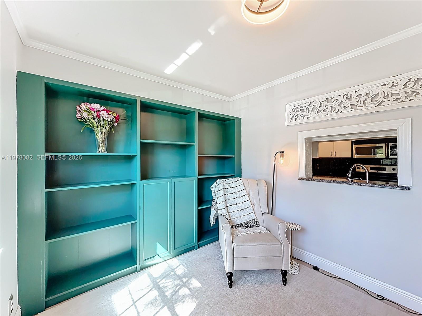 2128 Northeast 9th Avenue Wilton Manors, FL 33305 - Photo 5 of 34 a living room with furniture and a flat screen tv