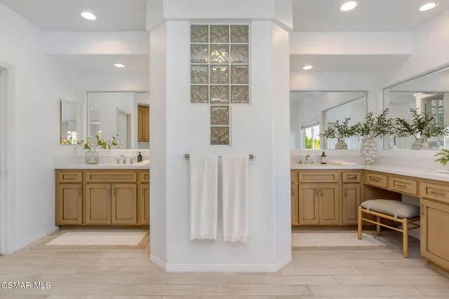 a bathroom with a sink double vanity and a mirror