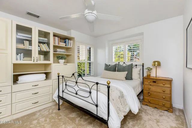 a spacious bedroom with a bed and with furniture