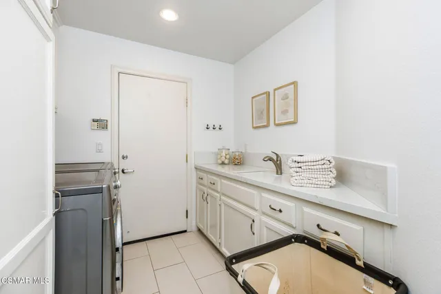 a bathroom with a double vanity sink and mirror