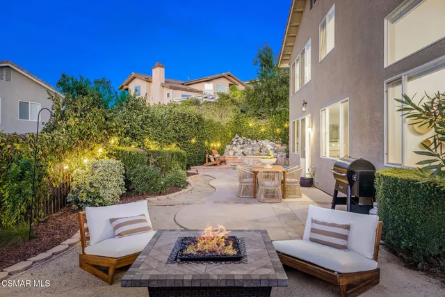 a outdoor space with patio the couches and a potted plant on the table