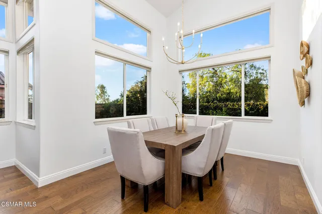 a dining room with furniture window wooden floor