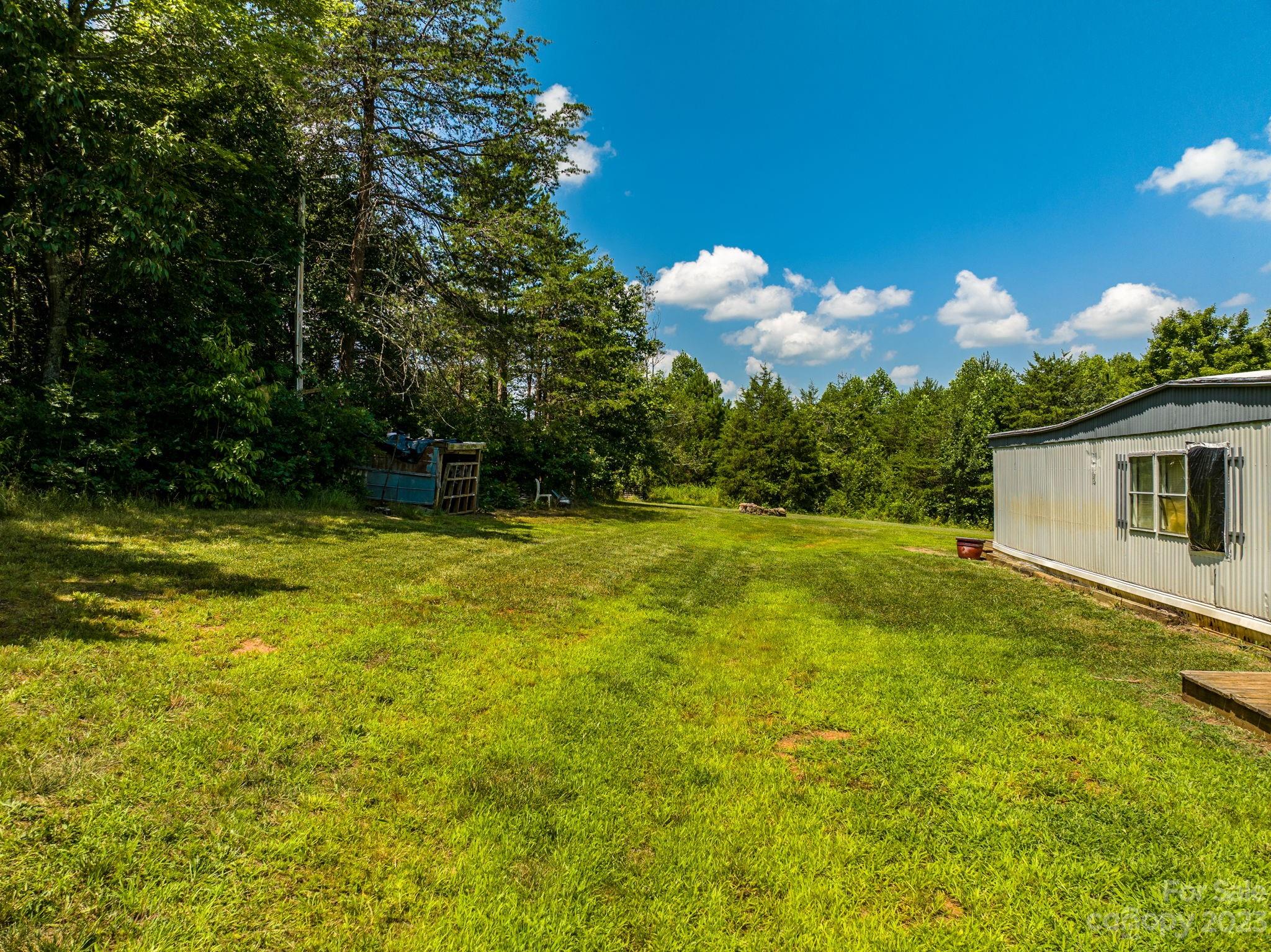 936 Goble Road Hiddenite, NC 28636 - Photo 12 of 32 a view of a house with a backyard