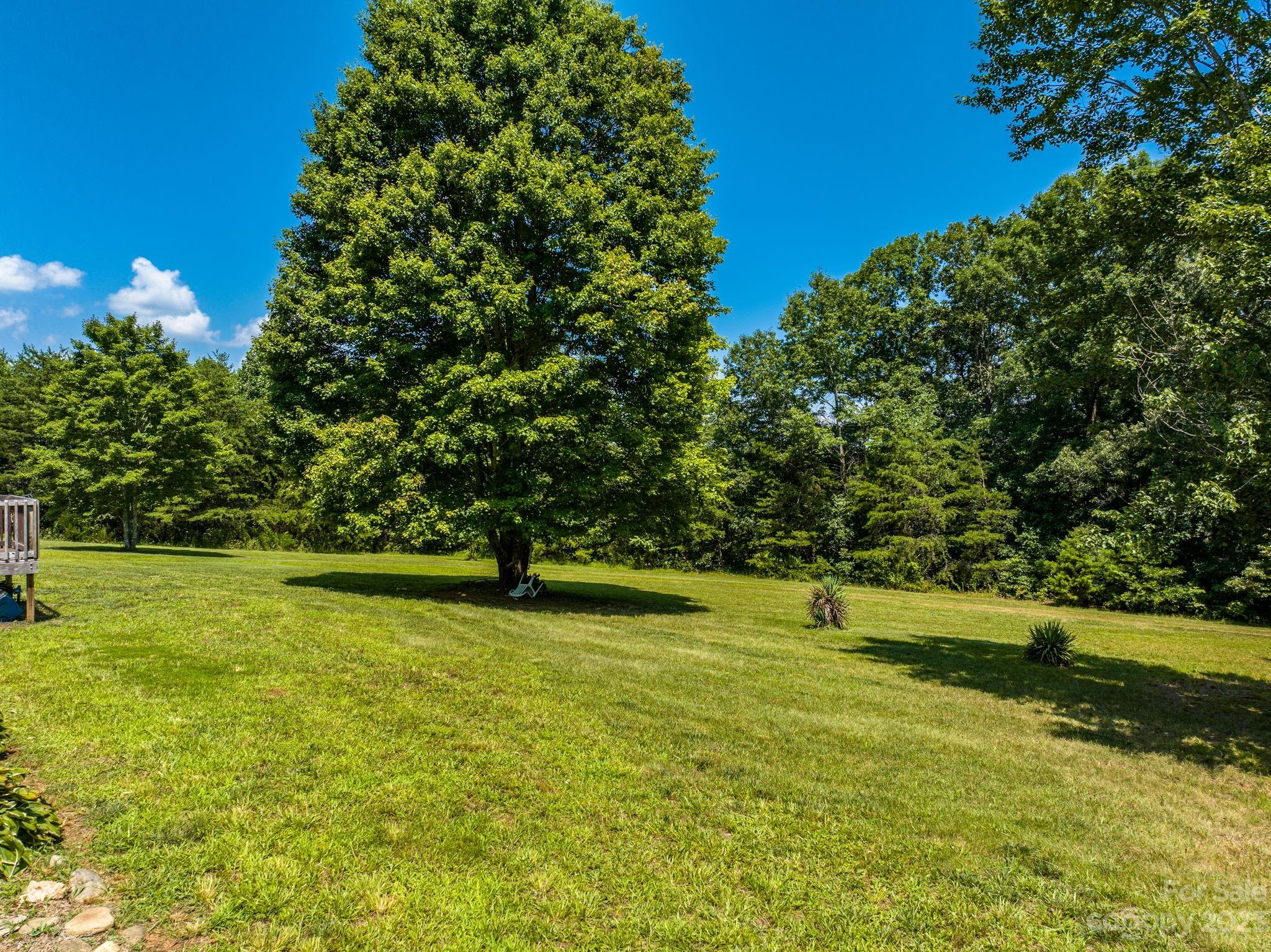936 Goble Road Hiddenite, NC 28636 - Photo 13 of 32 a view of a golf course with a lake