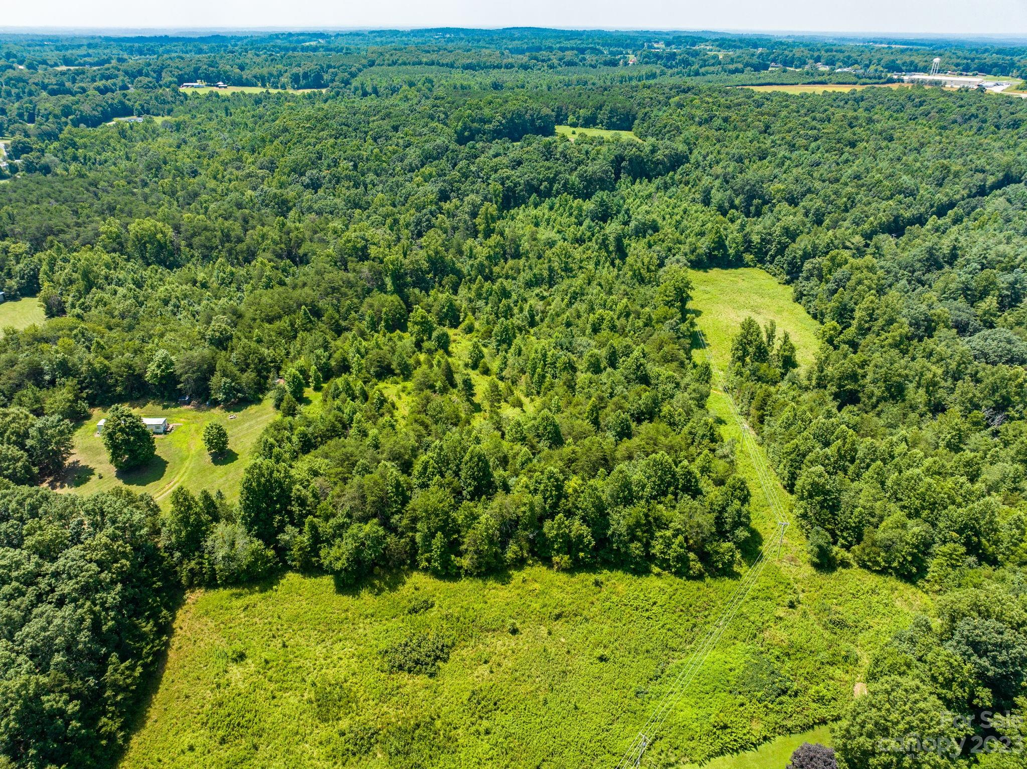 936 Goble Road Hiddenite, NC 28636 - Photo 17 of 32 a view of a green field