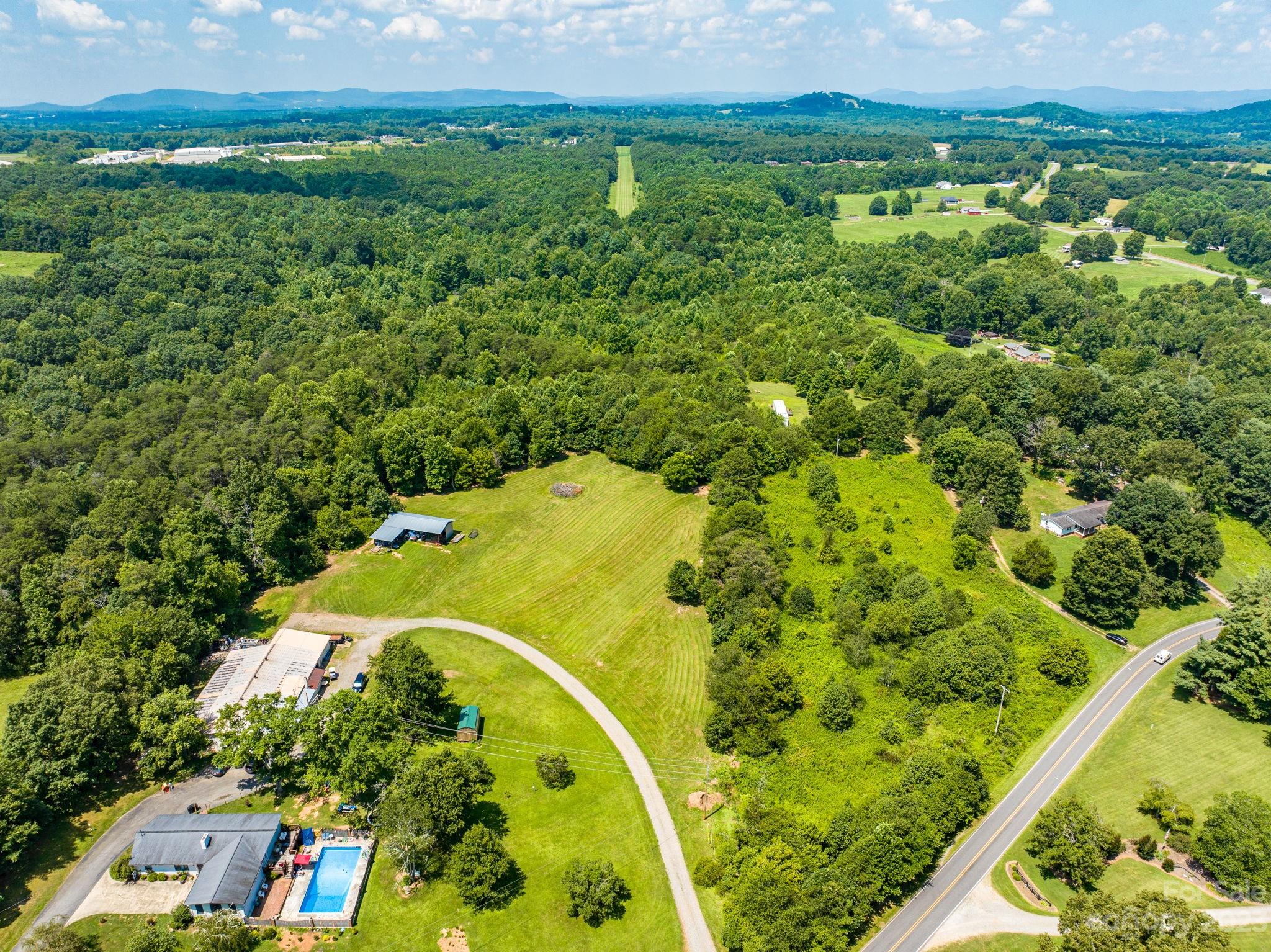 936 Goble Road Hiddenite, NC 28636 - Photo 23 of 32 a view of a garden with an ocean view