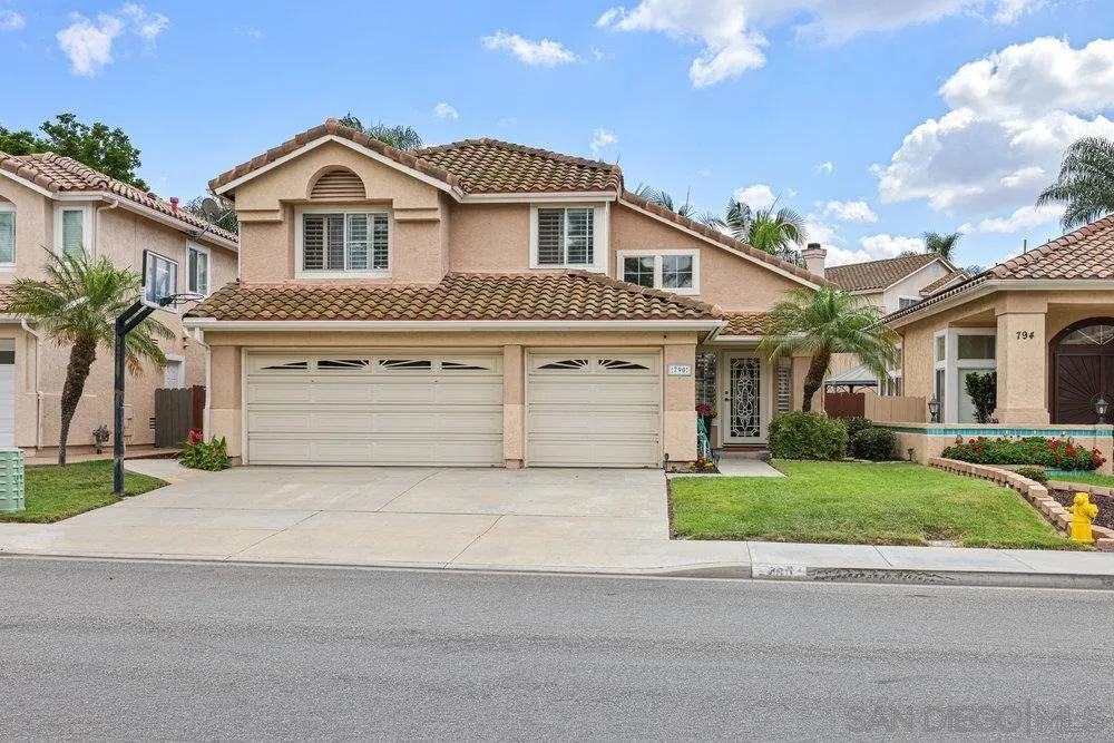 790 Mosaic Circle Oceanside, CA 92057 - Photo 2 of 47 a front view of a house with a yard and garage