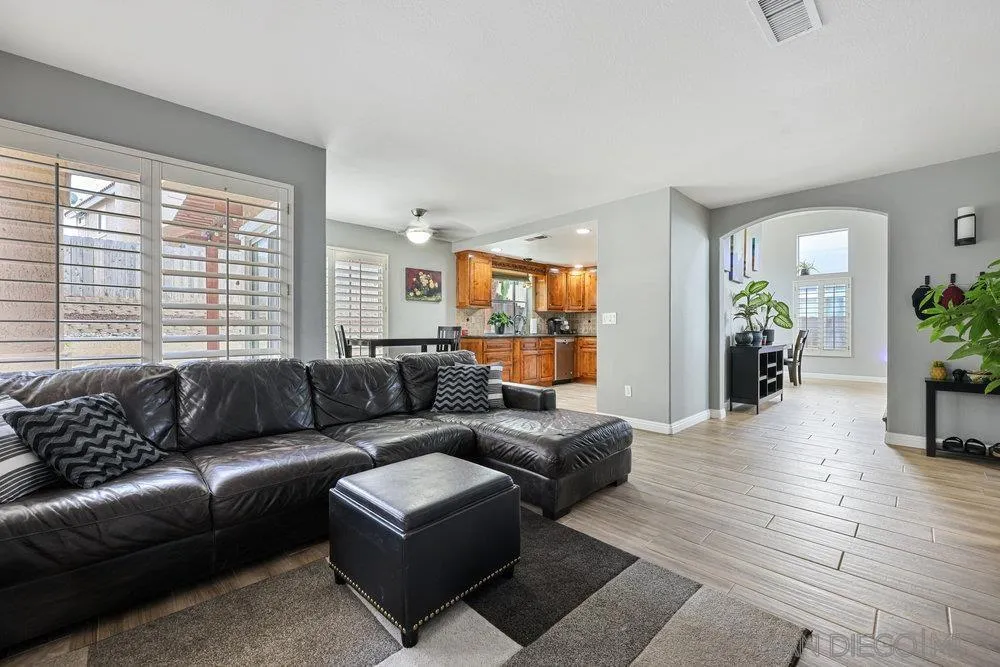 790 Mosaic Circle Oceanside, CA 92057 - Photo 26 of 47 a living room with furniture and wooden floor