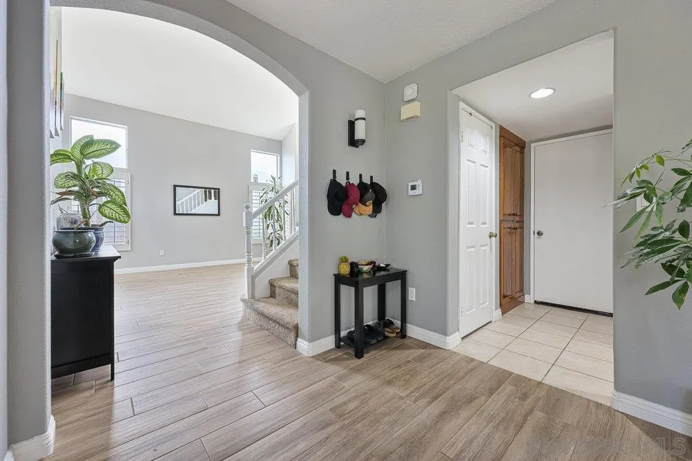 790 Mosaic Circle Oceanside, CA 92057 - Photo 28 of 47 a view of an entryway with wooden floor and windows