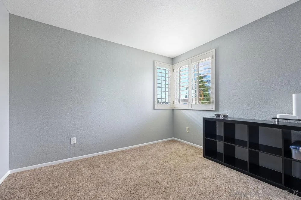 790 Mosaic Circle Oceanside, CA 92057 - Photo 32 of 47 a view of an empty room with furniture and window