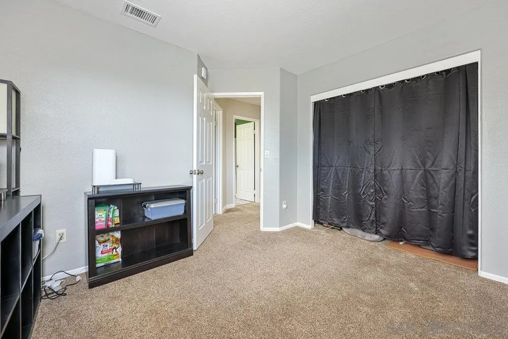 790 Mosaic Circle Oceanside, CA 92057 - Photo 33 of 47 a view of an empty room with furniture and a fireplace