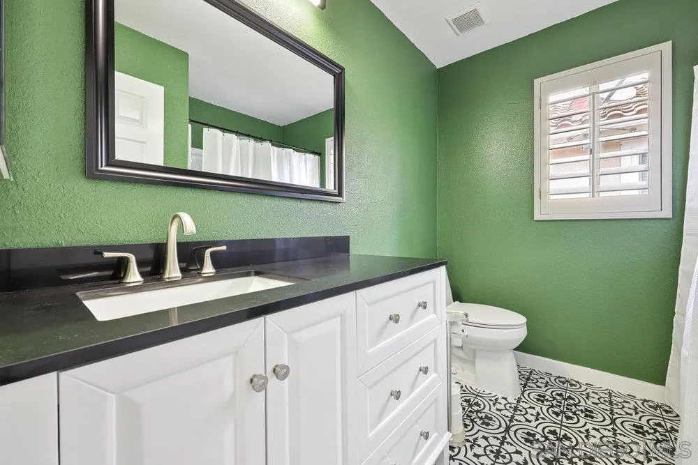 790 Mosaic Circle Oceanside, CA 92057 - Photo 35 of 47 a bathroom with a sink and a toilet