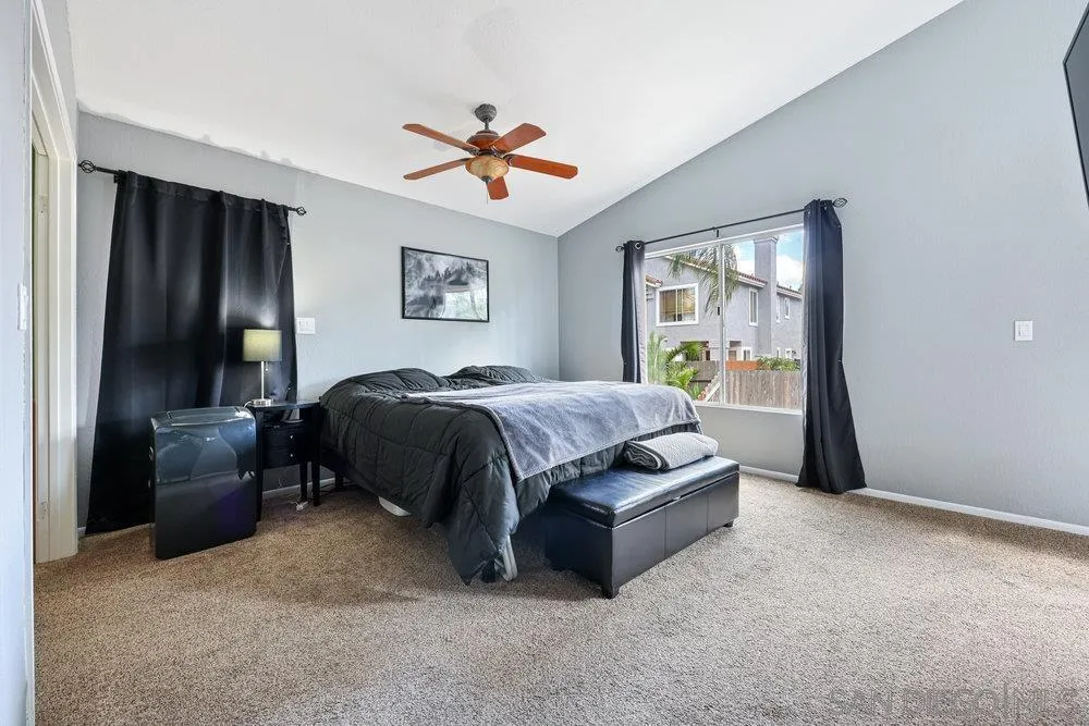 790 Mosaic Circle Oceanside, CA 92057 - Photo 36 of 47 a bedroom with a bed and a chandelier