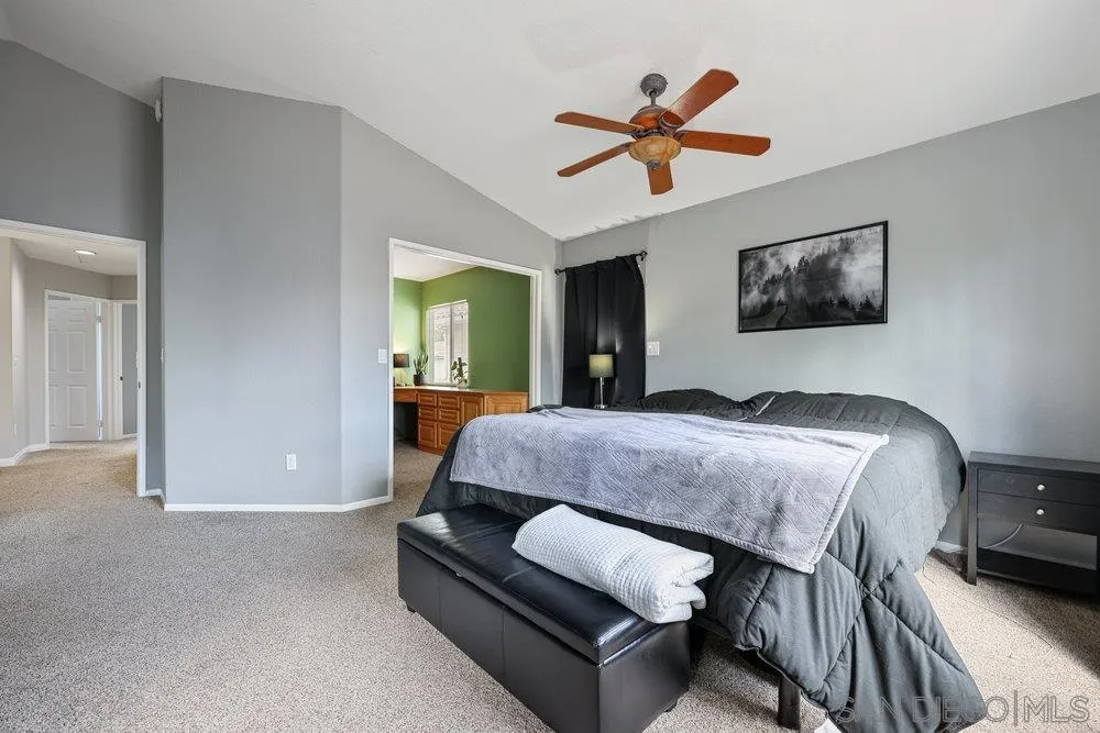 790 Mosaic Circle Oceanside, CA 92057 - Photo 37 of 47 a bedroom with a bed and a chandelier